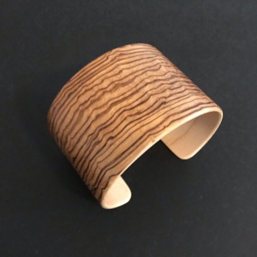 Handmade zebra wood bent veneer cuff.